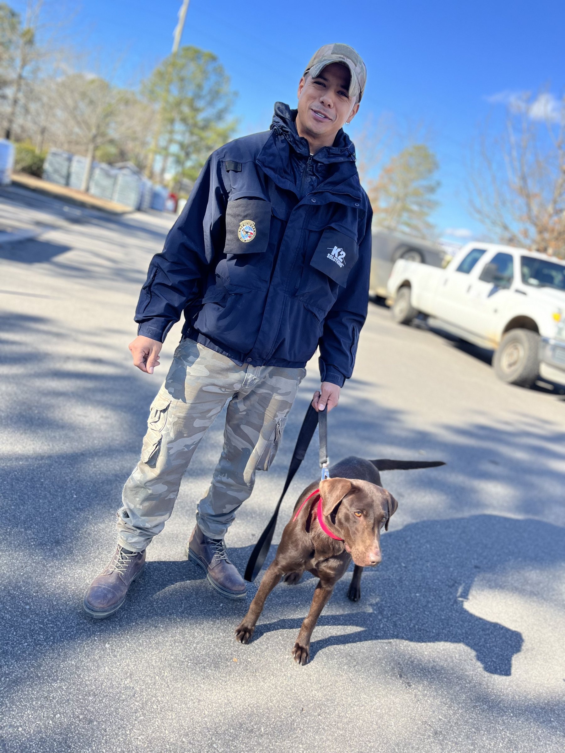 AI K9 handler in K9 jacket with dog